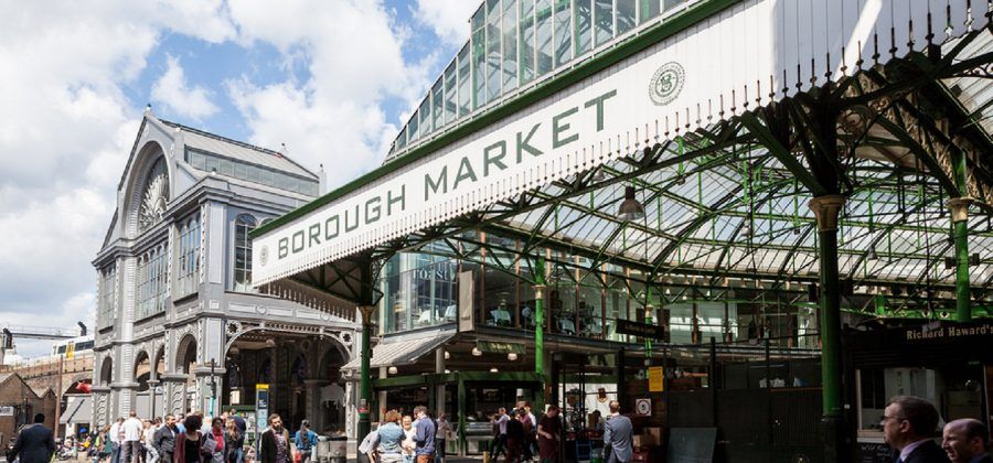 Entrance to Borough market with people.