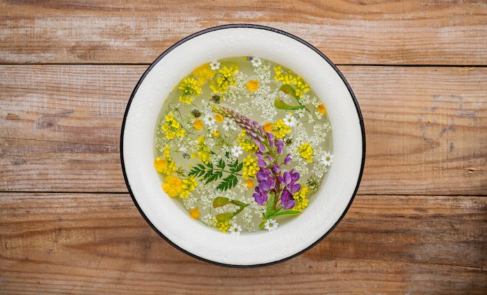 washbowl with water and flowers