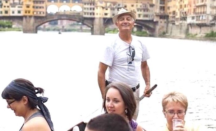group enjoy a gondola tour in Florence.