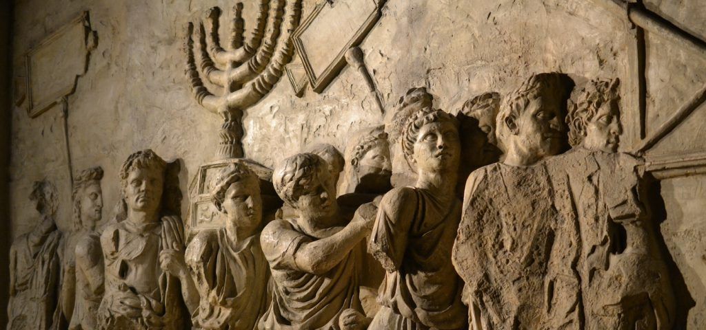 Marble depiction of roman soldiers holding a minora.