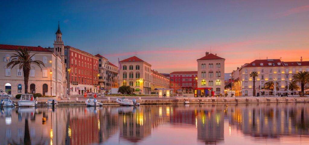 Ocean front buildings in Split Croatia during sunset.
