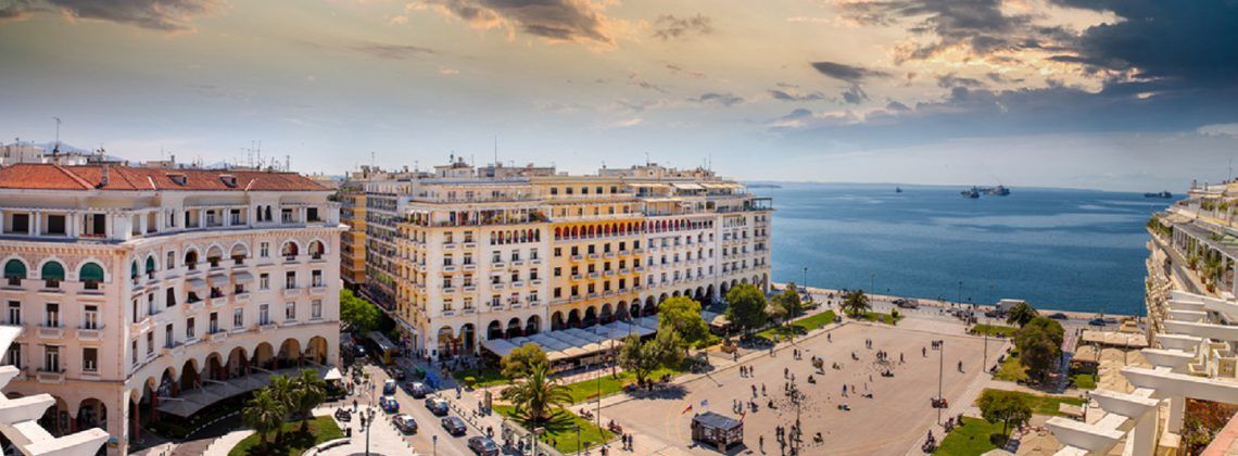 Aerial view of square in Thessaloniki with ocean.