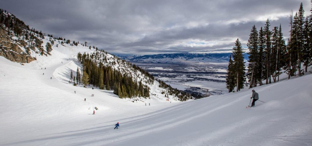 People skiing down a mountain in Jackson Hole