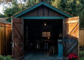 Doors open into wooden shed.