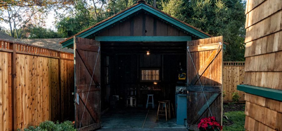 Doors open into wooden shed.