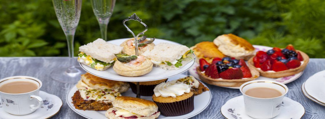 Plates of traditional English afternoon tea.