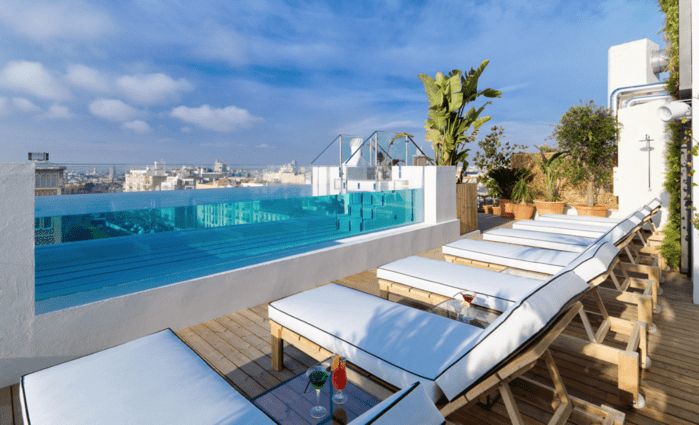Coolest Hotels with pools in Madrid near Retiro Park with rooftops; H10 Puerta de Alcalá