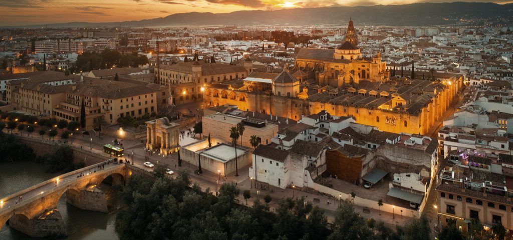 Aerial view of the city of Cordoba with the sunset in the background.