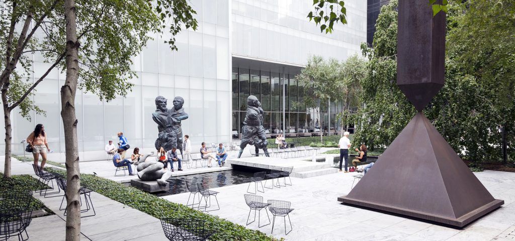 Interior of the Abby Aldrich Rockefeller Sculpture Garden with people.