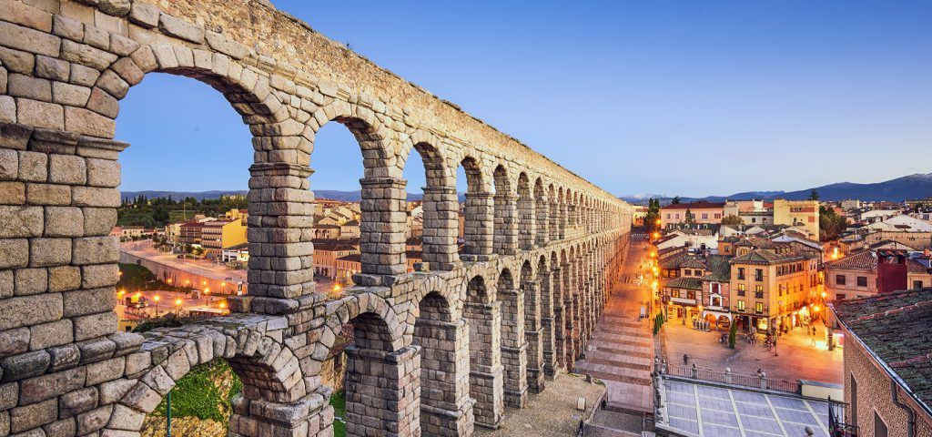Stone wall in Segovia Spain at night.
