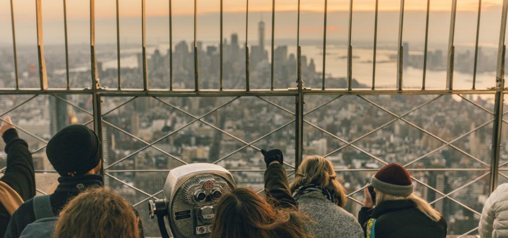 People at the top of the Empire State building in NYC.