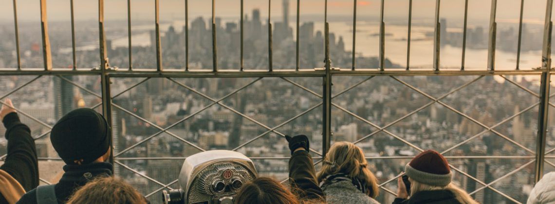 People at the top of the Empire State building in NYC.