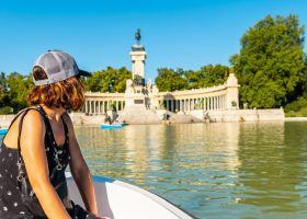 Person in a boat at Retiro park Madrid.