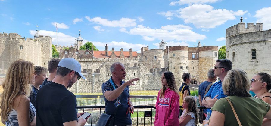 People taking a tour of the tower of London.