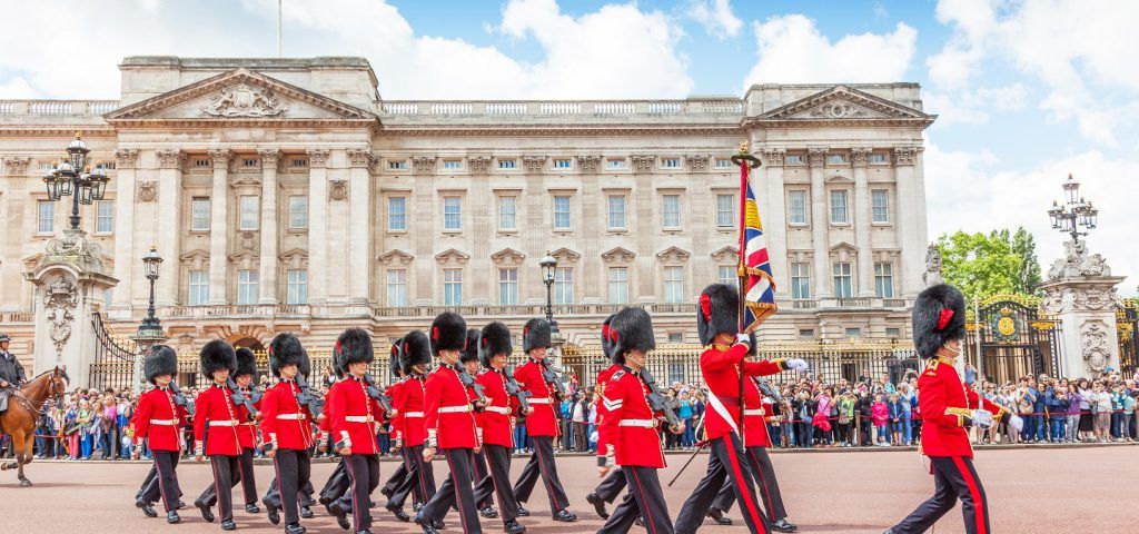 Guards marching next to the Buckingham Palace.