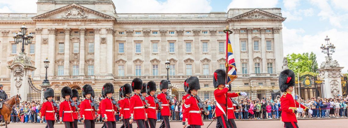 Guards marching next to the Buckingham Palace.