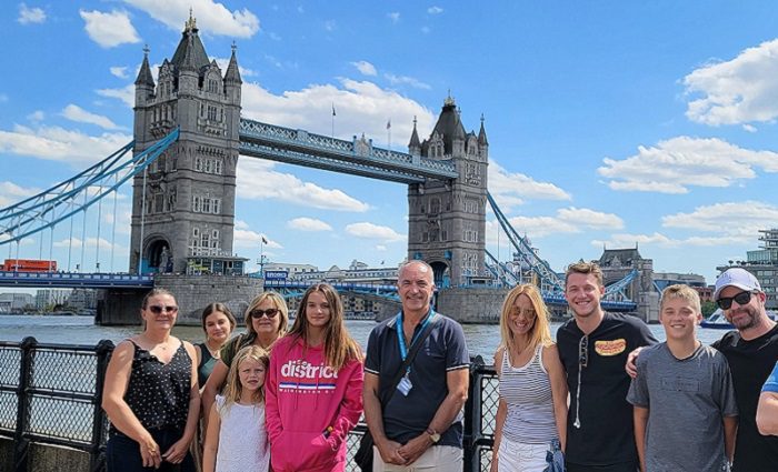 people standing in front of tower bridge in london