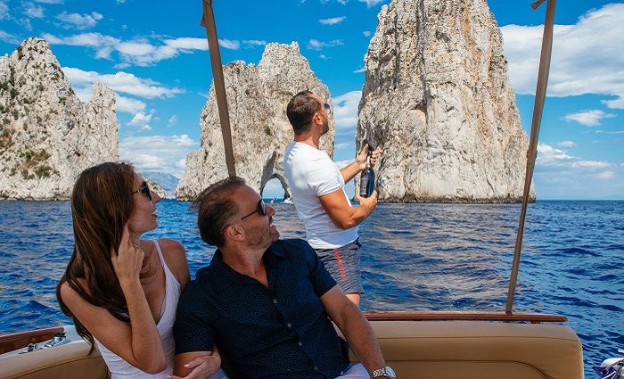 People on a boat off the coast of Capri.