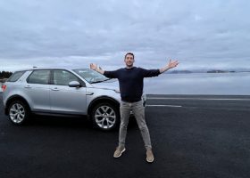 man in front of car on iceland ring road