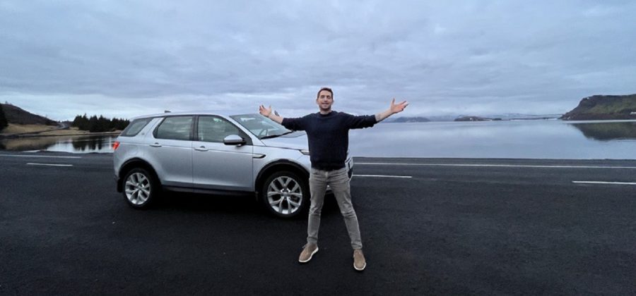 man in front of car on iceland ring road
