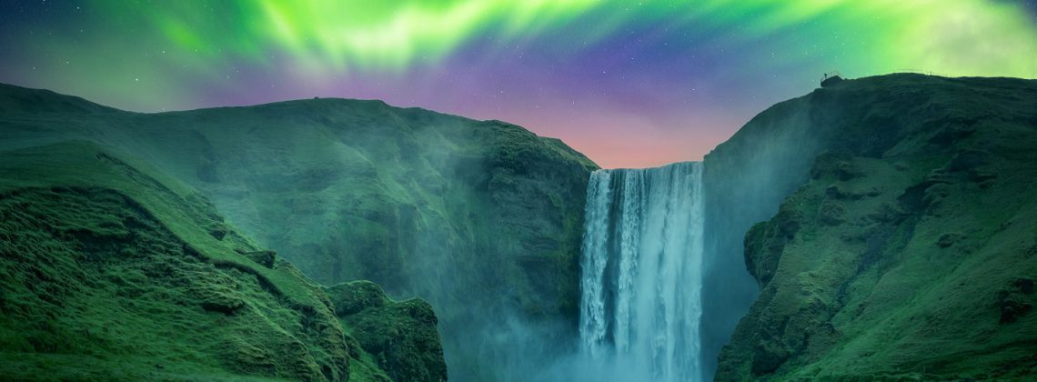 northern lights over skogafoss falls