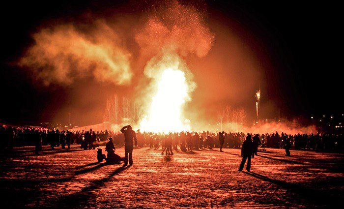 people at bonfire in iceland