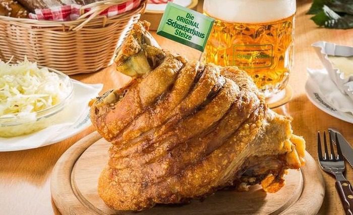 a top food to try in Vienna, pork knuckle served with crispy outer skin and tender meat