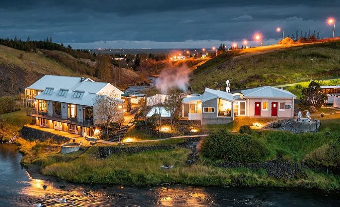 hotel at night near river in iceland