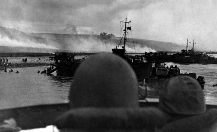 men's helmets looking at d-day beaches during invasion