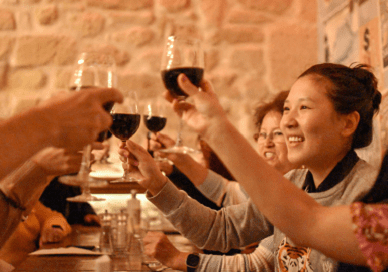 women toasting wine