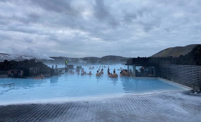 people in blue lagoon pool