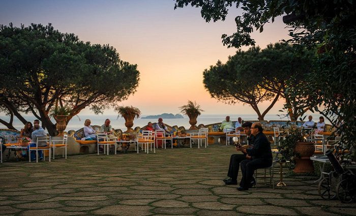 people eating at sunset at the sea