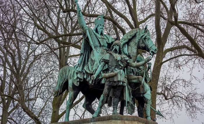 statue of Charlemagne on horse with guard nearby
