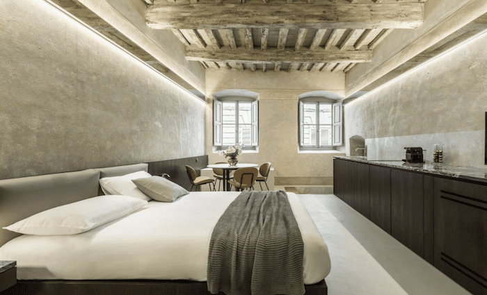 The modern bedroom with wood beamed ceilings.