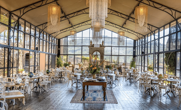 The dramatic glass dining room of the Michelin starred restaurant, housed in the former orangery.