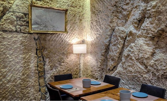 An image of the rock walls of the dining room at La Grotta