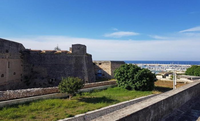 a view from the balcony of the port and the castle