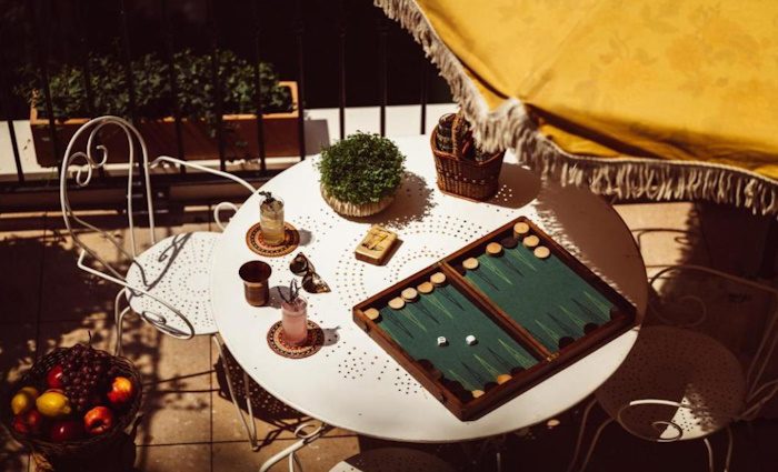 courtyard with a table and a backgammon set