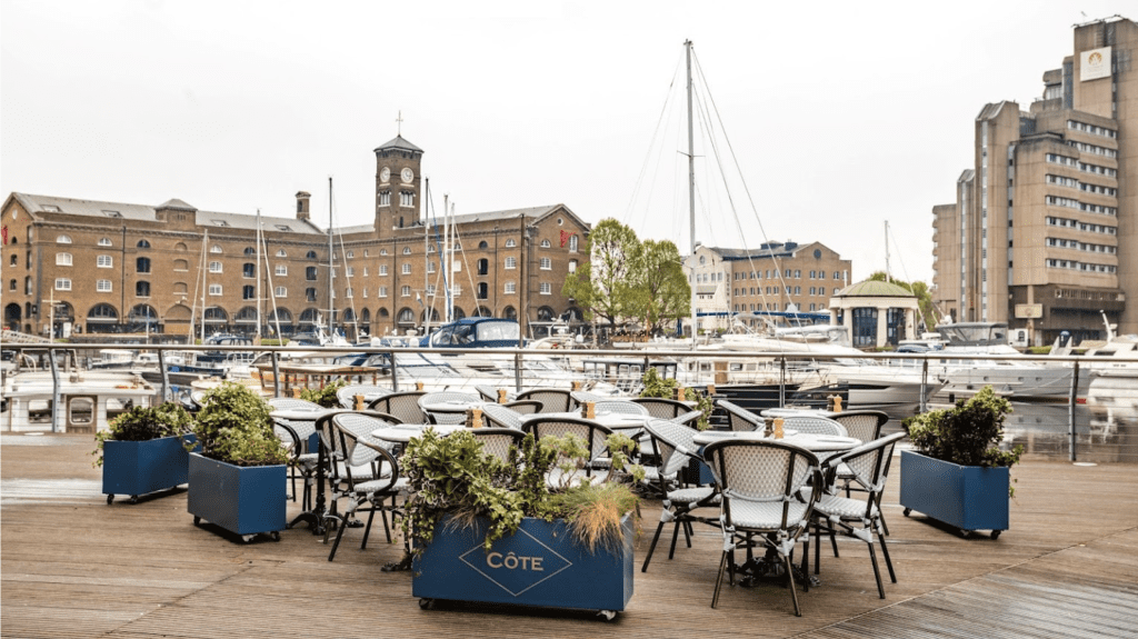 Tables overlooking the marina at Cote restaurant in London