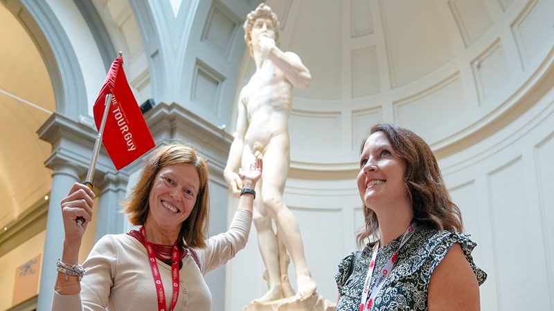 A tour group enjoying the David on one of the best tours of Florence.