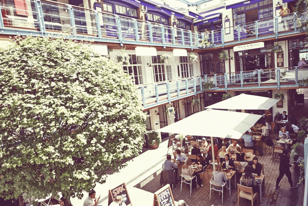 Chairs with umbrellaed tables at Kingly Court London