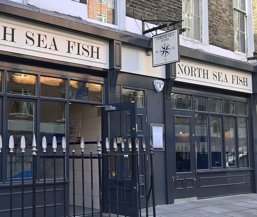 White North Sea Fish Restaurant sign with black font