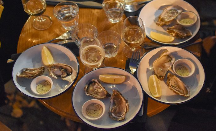 Oysters and Champagne make this one of the best food tours of Paris