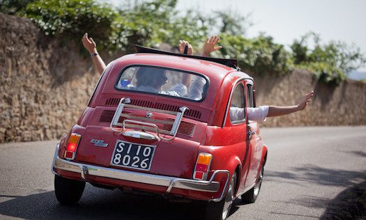 A group drive a a vintage Fiat 500 out of Florence on one of our best Florence tours.