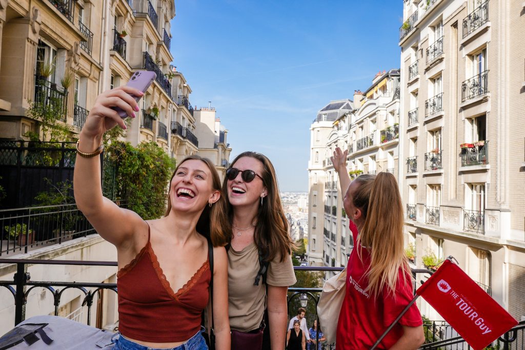 Three people taking a selfie style photo in Paris, France