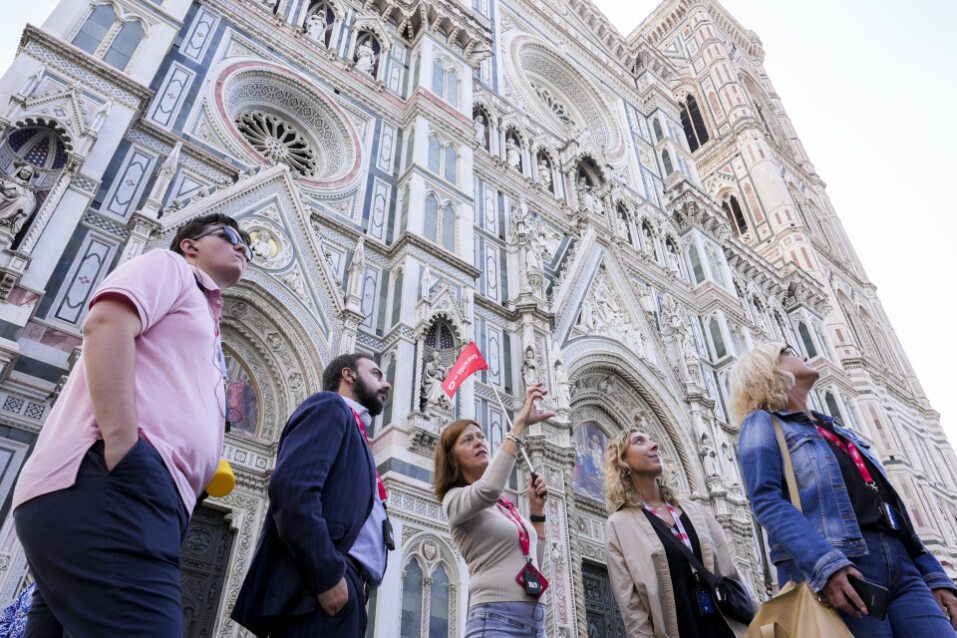A group of tourists in front of the Florence Cathedral with a guide from The Tour Guy.