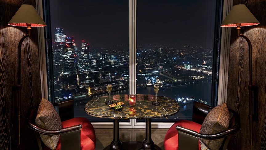 Red chairs overlooking the London skyline.