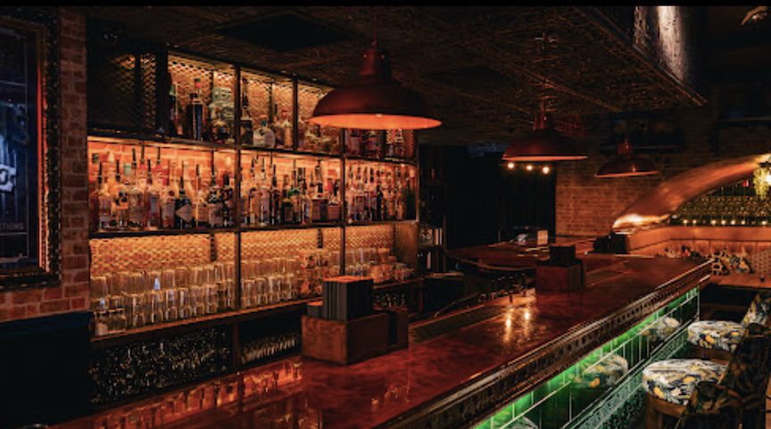 A light illuminates the back of the bar.