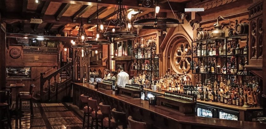 Leather seats next to a wooden bar at Waxy O'Connor's in London.