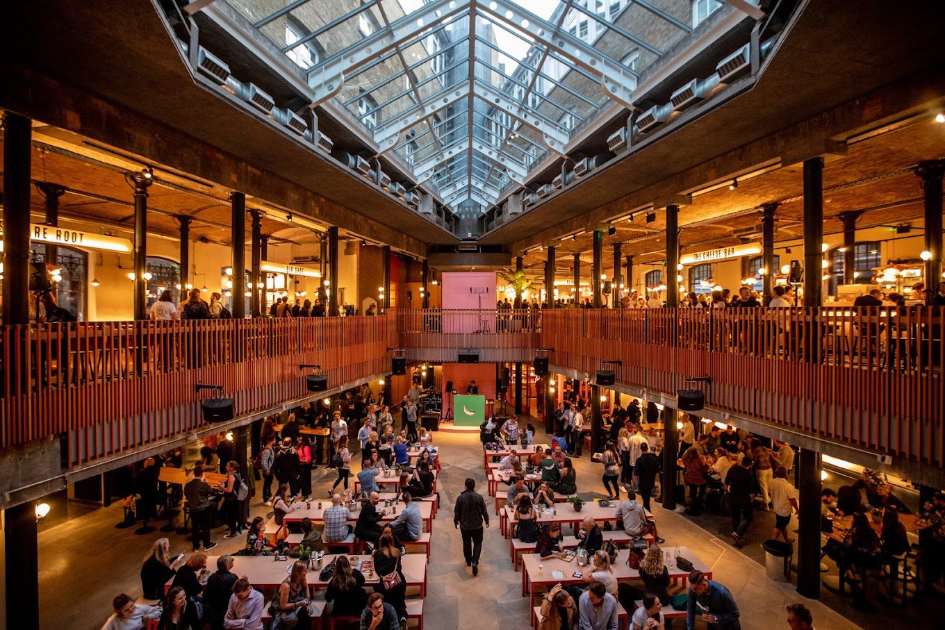 People sit at tables in Seven Dials dining hall. 